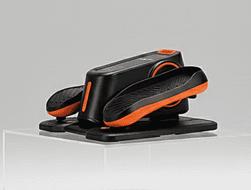 Elderly couple using stepper at home