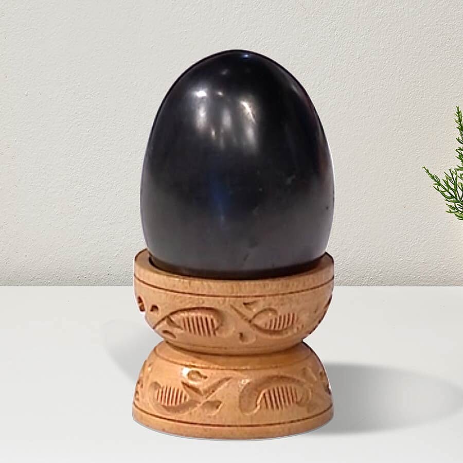 Oval Shape Shungite with Wooden Stand (Size 6x4.2x4.1 Cm) 660.00 Ct