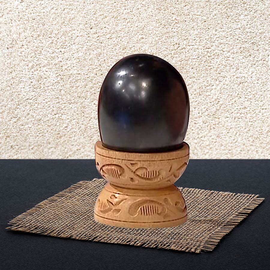 Oval Shape Shungite with Wooden Stand (Size 6x4.2x4.1 Cm) 660.00 Ct