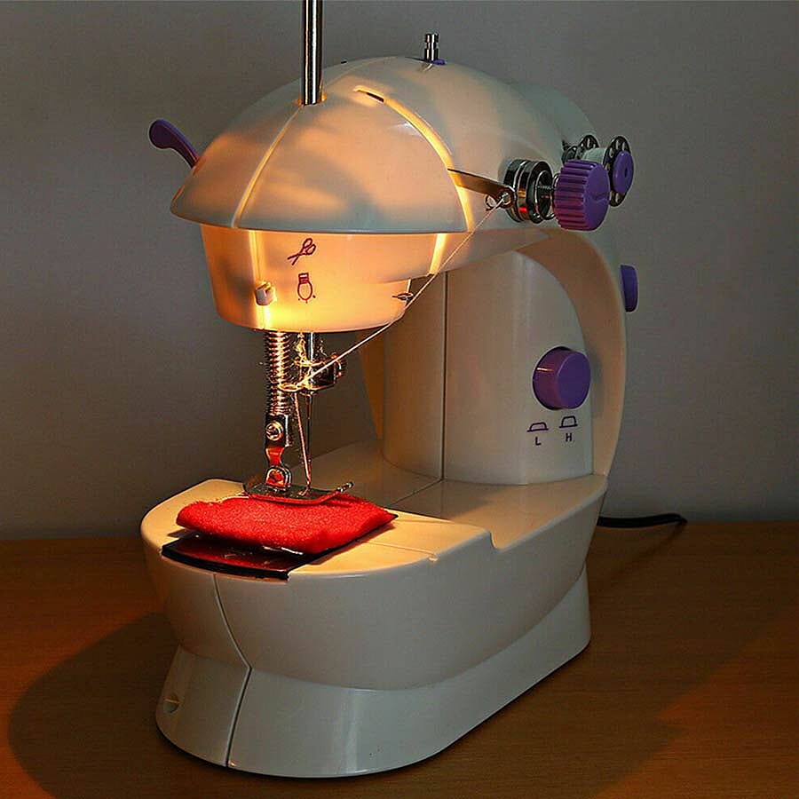 Multifunctional & Portable Mini Double Thread Sewing Machine - (Includes- 1 Needle, 1 Needle Threader, 4 Bobbins, 1 Foot Pedal & Adapter) - White & Purple