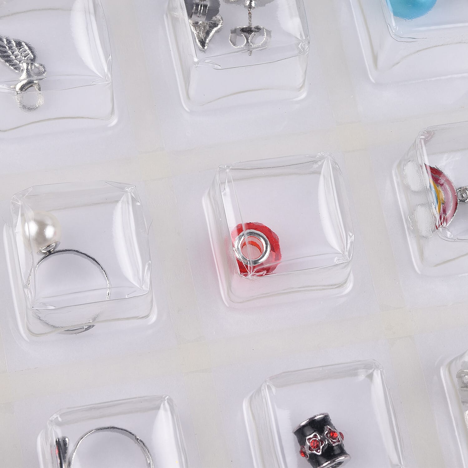 TJC Advent Calendar- 24 Pieces of Jewellery Including Necklace (Size 21.5), Bracelet,  Adjustable Rings, Pendants with Chain (Size 31 with Extender), Earrings and Charms