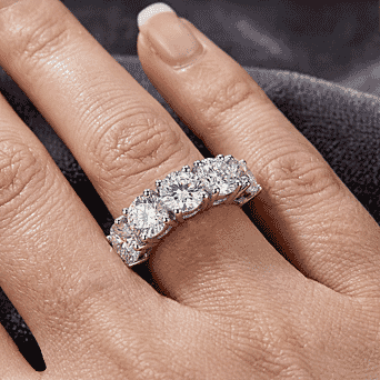 https://tjcuk.sirv.com/Products/38/9/3890386/Moissanite-5-Stone-Ring-in-Rhodium-Plated-Sterling-Silver-2-25-Ct_3890386_1.jpg?w=342&h=342