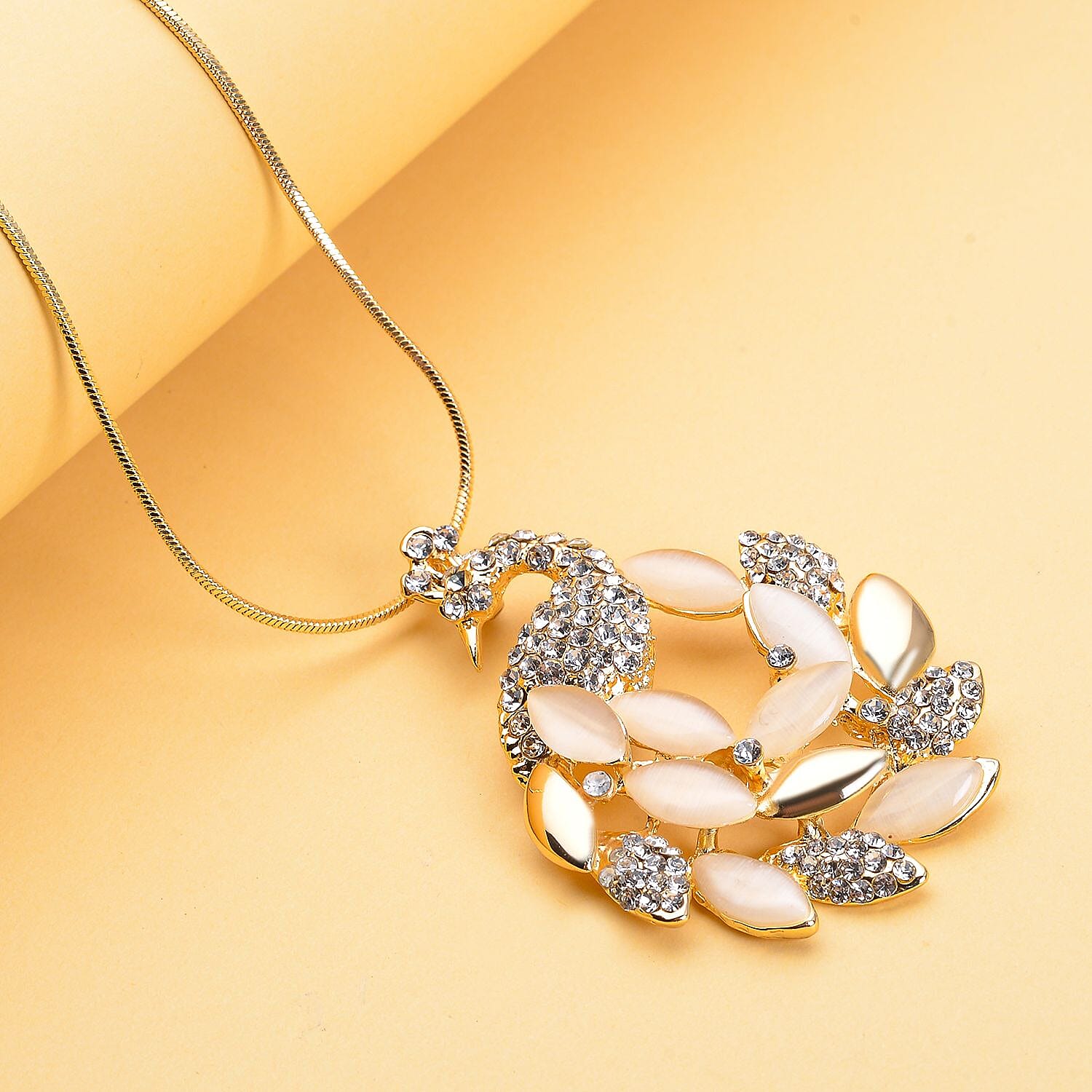 White Cats Eye and White Austrian Crystal Peacock Pendant with Chain (Size - 28 With 2 Inch Extender) in Yellow Gold Tone