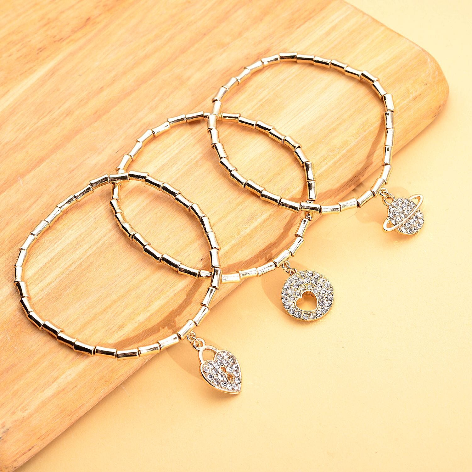Set of 3 - White Austrian Crystal Heart, Circle of Life & Planet Charm Stretchable Bracelet (Size 7.5) in Yellow Gold Tone