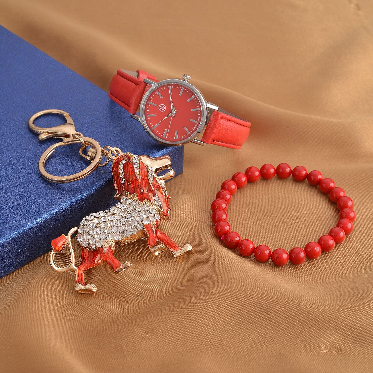 3 Piece Set - Red Howlite Stretchable Beads Bracelet (Size 8), White and Black Austrian Crystal Studded Lion Key Chain and STRADA Water Resistant Watch with Red Strap