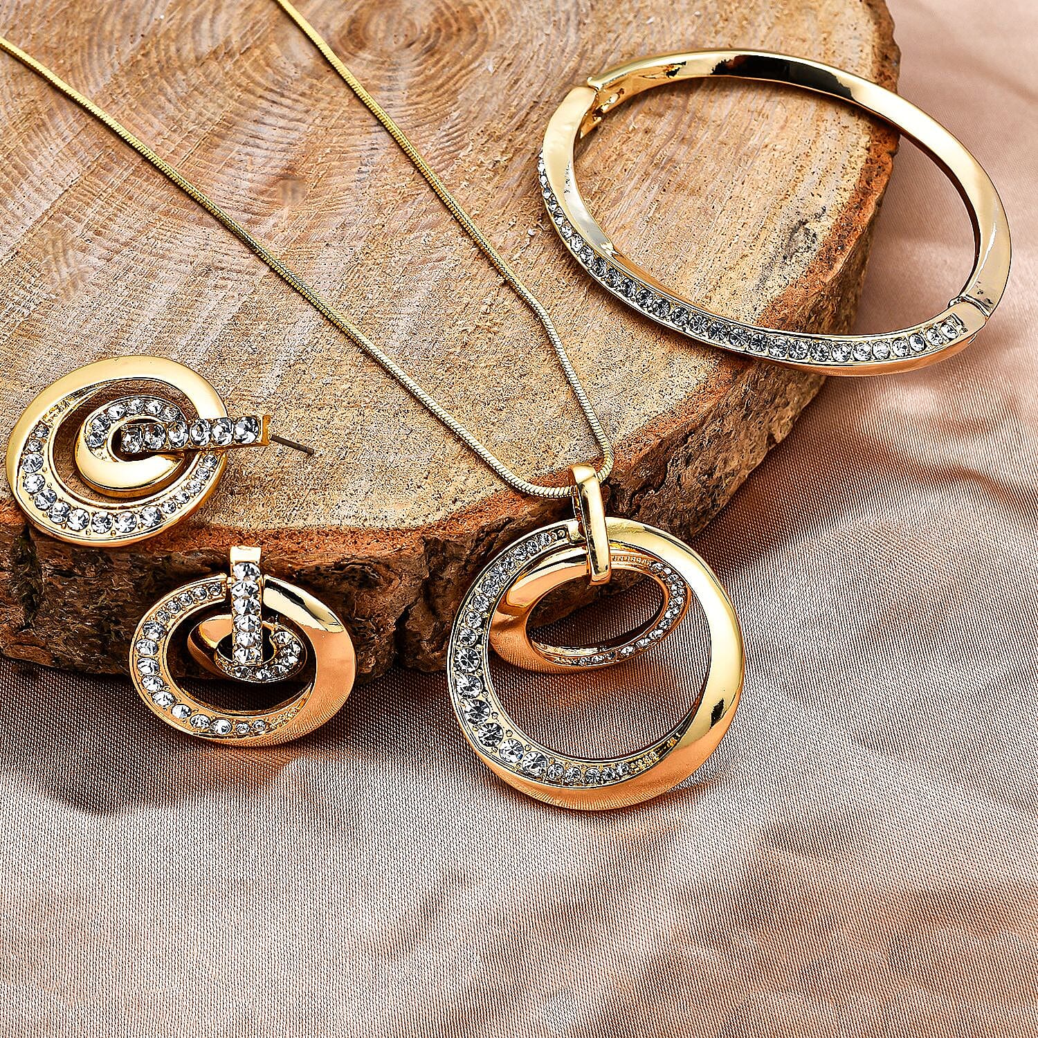 3 Piece Set - White Austrian Crystal Bangle (Size - 6.75 ), Necklace (Size - 24 with 2 Inch Ext.) and Earrings in Yellow Gold Tone.