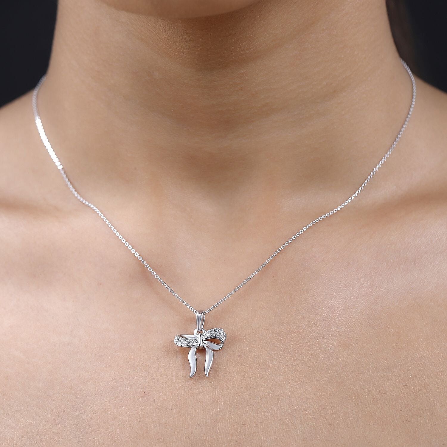Moissanite Bow Tie Ribbon Pendant in Platinum Overlay Sterling Silver