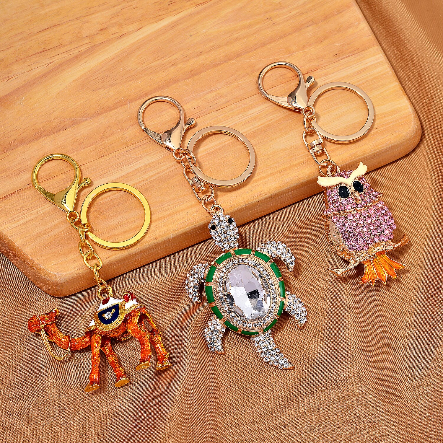 Set of 3 Crystal Key Chain in Yellow Gold Colour Plating. 1.Owl with Pink Crystal & Enamel; 2.Camel with White Crystal & Enamel; 3.Turtle with White & Black Crystal & Enamel.