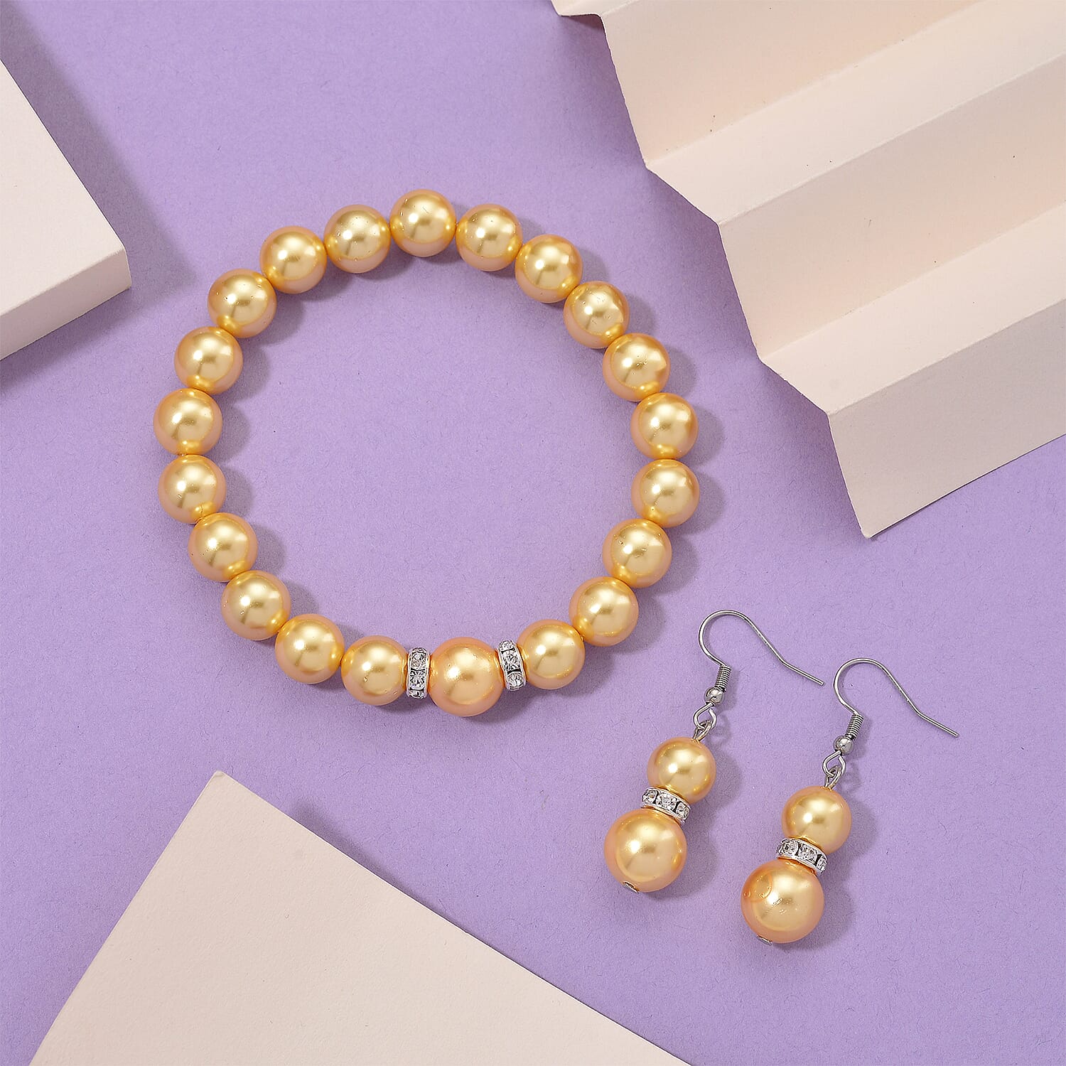 2 Piece Set - Golden Shell Pearl & Austrian White Crystal Earring with Hook & Strechable Bracelet (Size - 7.5) 169.00 Ct.