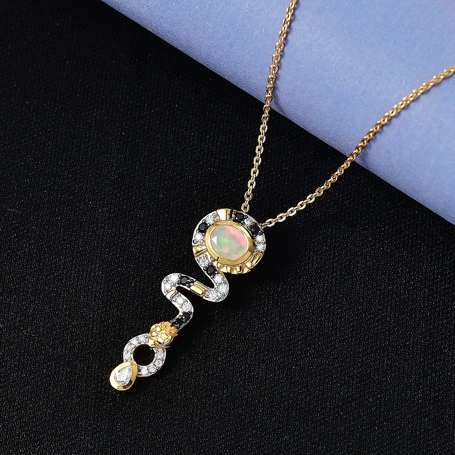 Faceted Ethiopian Opal, Moissanite & Black Spinel Pendant with Chain (Size 20) in Yellow Gold Plated Sterling Silver.
