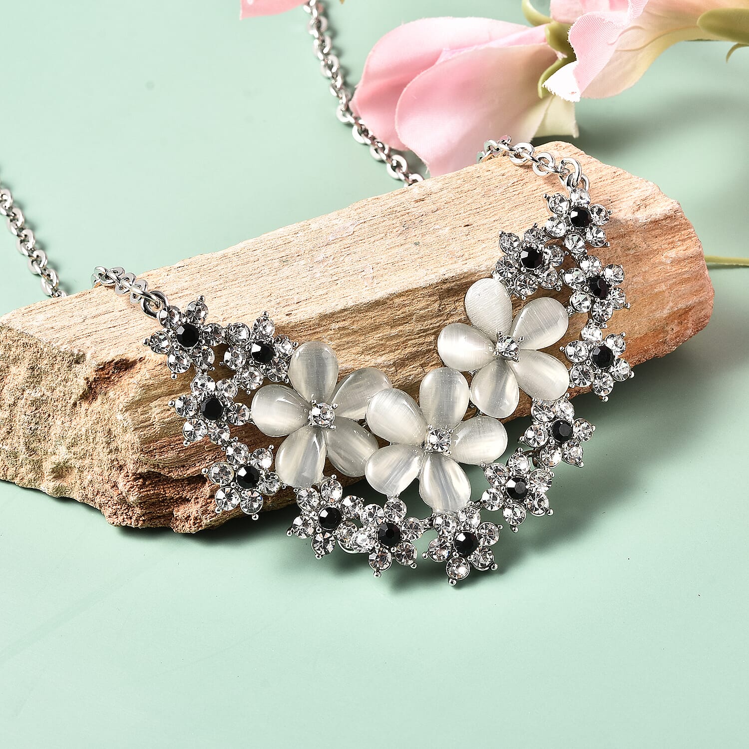 Simulated White Cats Eye, Black and White Crystal Floral Cluster Necklace (Size 20) in Silver Tone