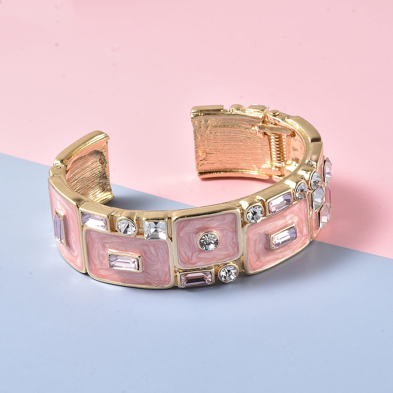 White Austrian Crystal, Simulated Diamond and Simulated Pink Sapphire Enamelled Bangle (Size 7) in Gold Tone