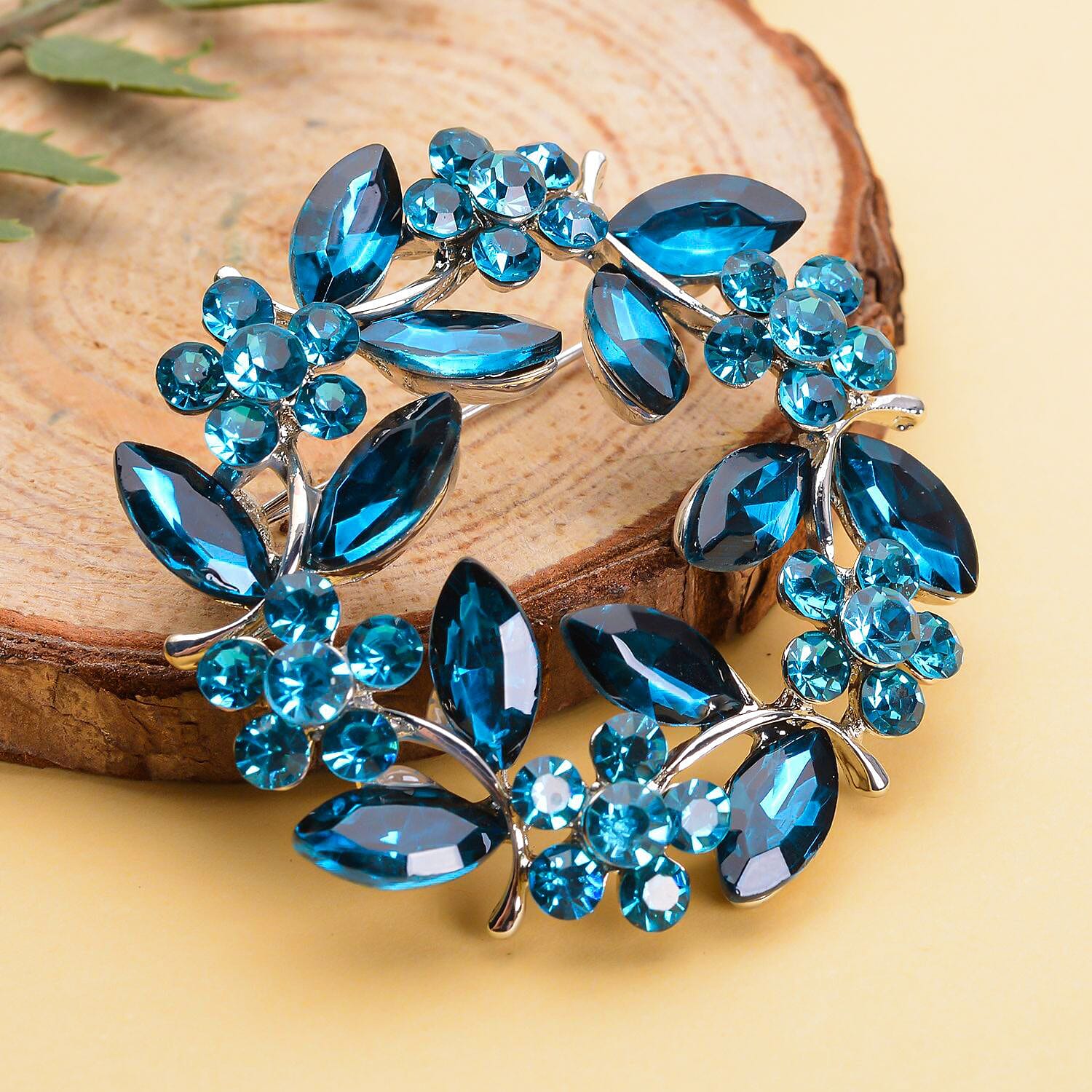 Blue Austrian Crystal and Simulated Apatite Wreath Embellished Brooch in Silver Tone Blue Austrian Crystal and Simulated Apatite Wreath Embellished Brooch in Silver Tone