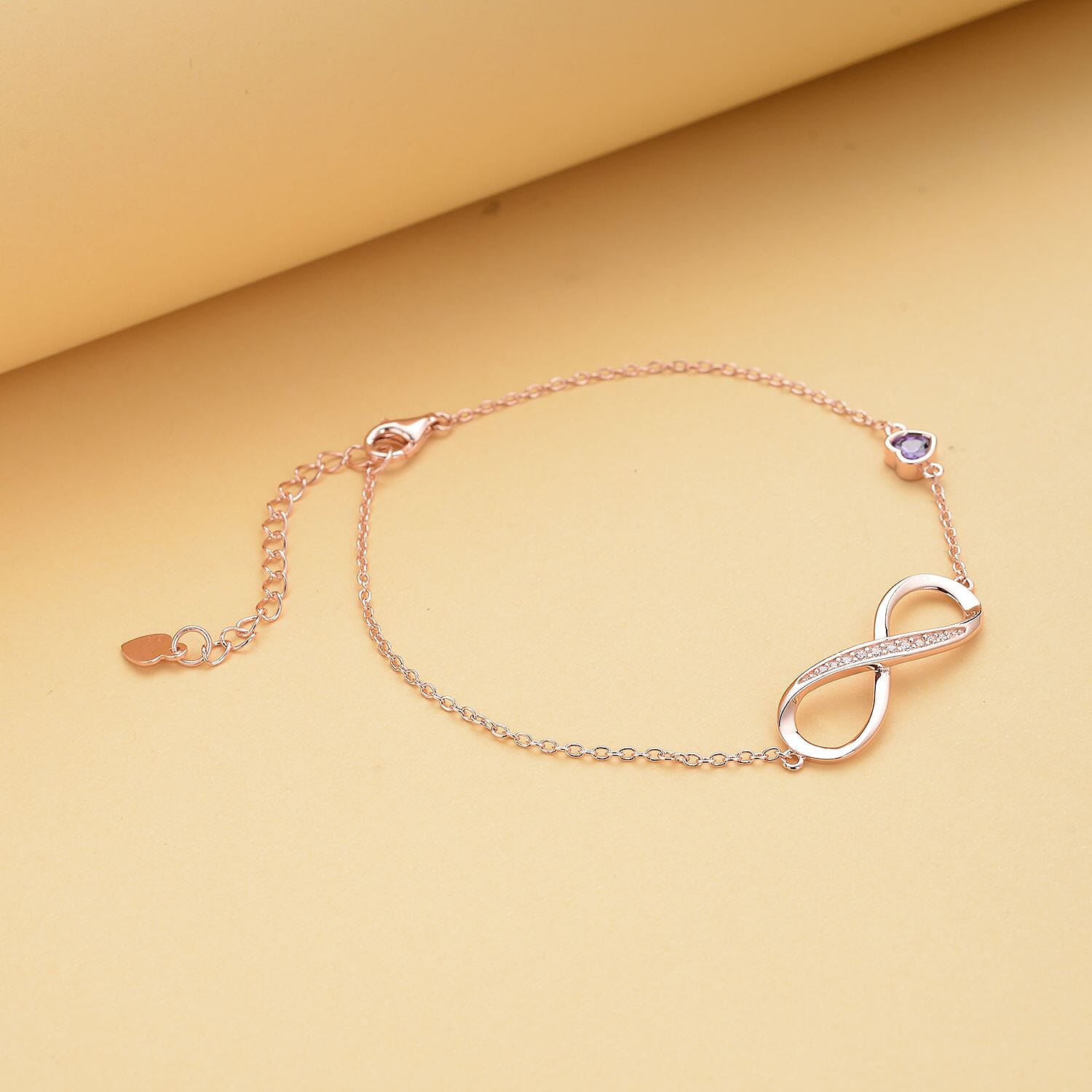 Simulated Purple Sapphire and Simulated Diamond Infinity Bracelet (Size - 7.5 With 1.5 Inch Ext.) in Vermeil Rose Gold Plated Sterling Silver.