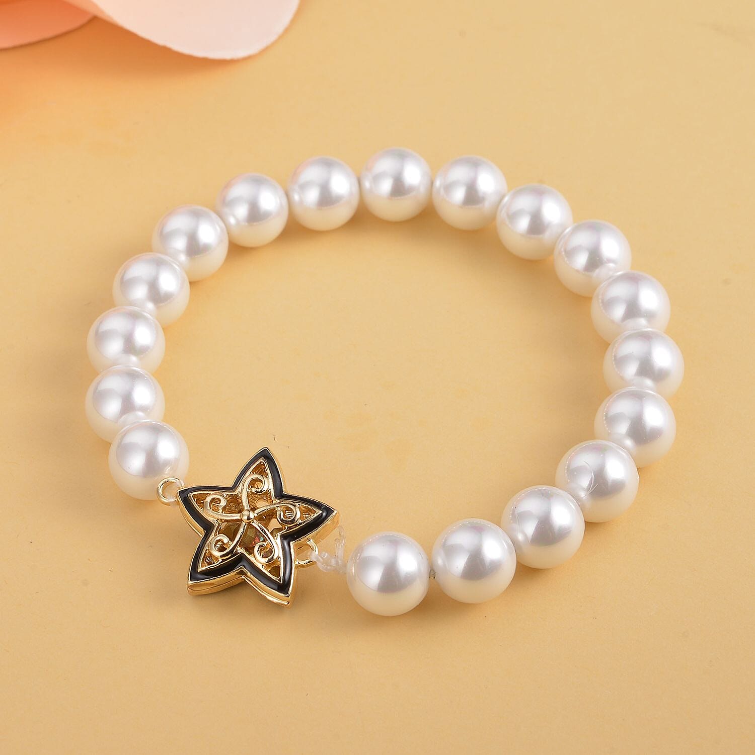 Simulated AB White Crystal and White Shell Pearl Bracelet (Size - 7) Strechable in Yellow Gold Tone With Enamelling