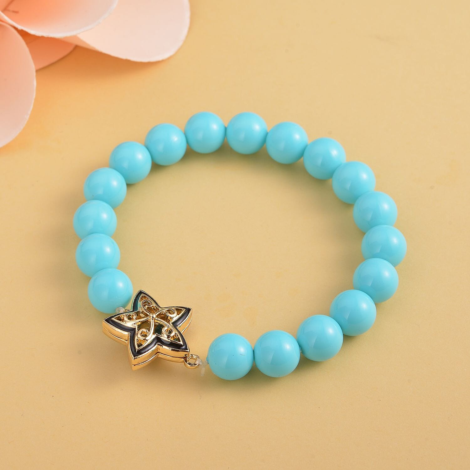 Blue Colour Austrian Crystal and Sleeping Beauty Colour Shell Pearl Bracelet (Size - 7) Stretchable in Yellow Gold Tone With Enamelling