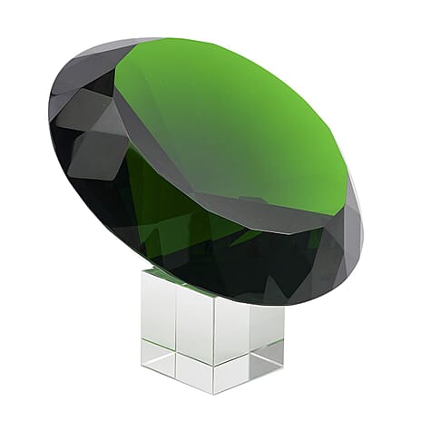 Diamond Shaped Green Coloured Crystal With Cubed Base and a Pair of Gloves