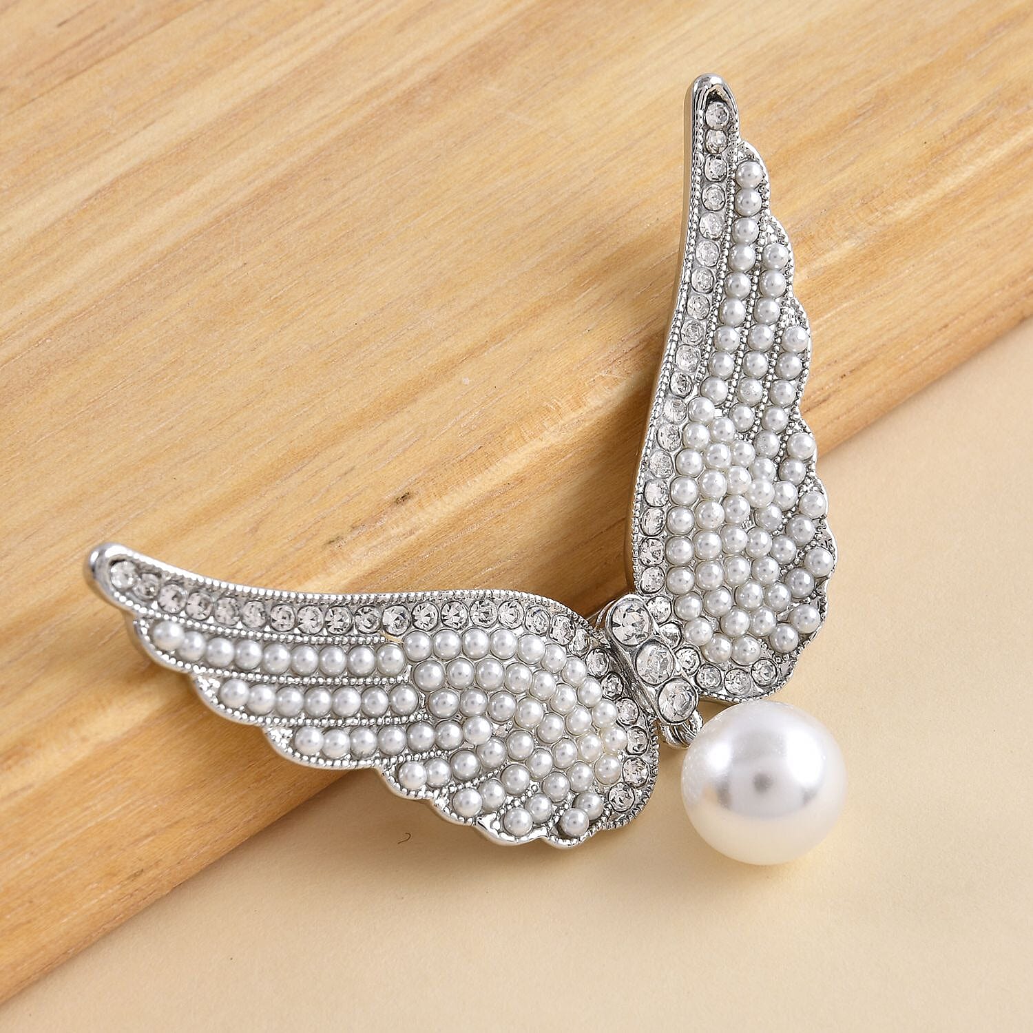 White Austrian Crystal and Simulated Pearl Angel Wings Brooch in Silver Tone