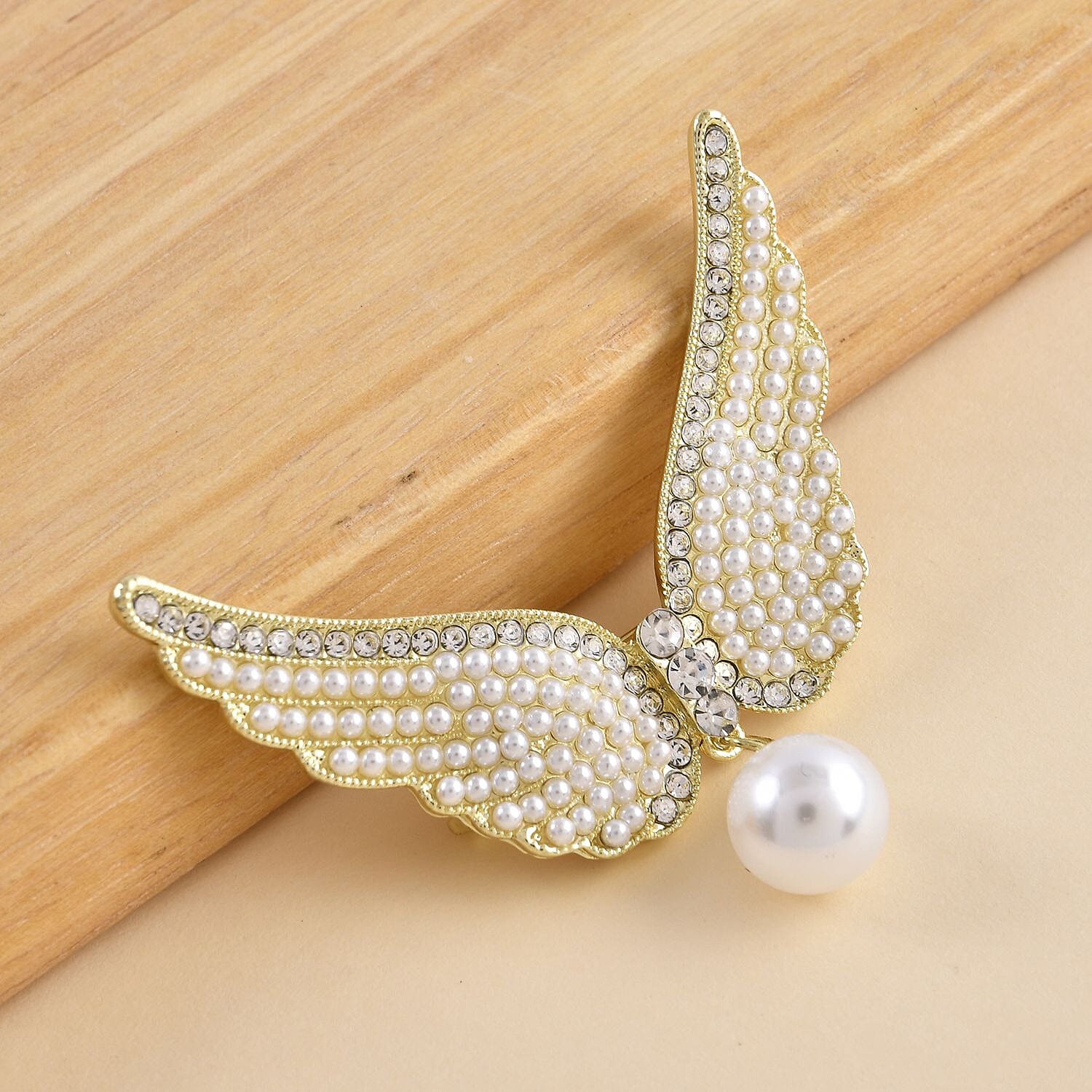 White Austrian Crystal and Simulated Pearl Angel Wings Brooch in Yellow Gold Tone