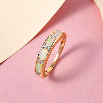 https://tjcuk.sirv.com/Products/72/3/7238293/9K-Yellow-Gold-AA-Ethiopian-Opal-and-White-Diamond-Band-Ring-0-74-ct_7238293_1.jpg?w=342&h=342