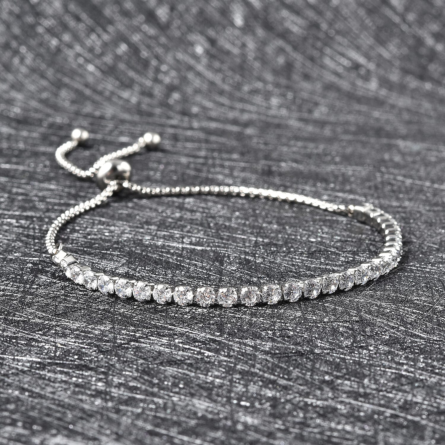 Simulated Diamond Bracelet (Size 6-9 inch Adjustable) in Silver Tone