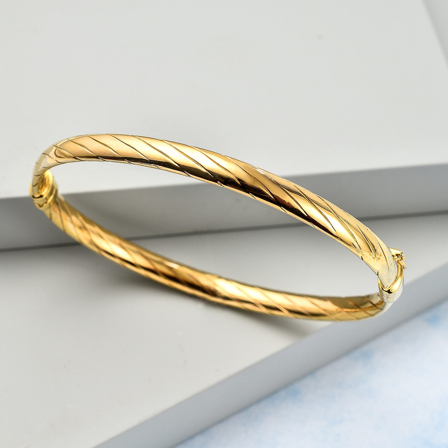 Italian Made Closeout Deal - 9K Yellow Gold Twist Bangle (Size - 7), Gold Wt 4.15 Gms
