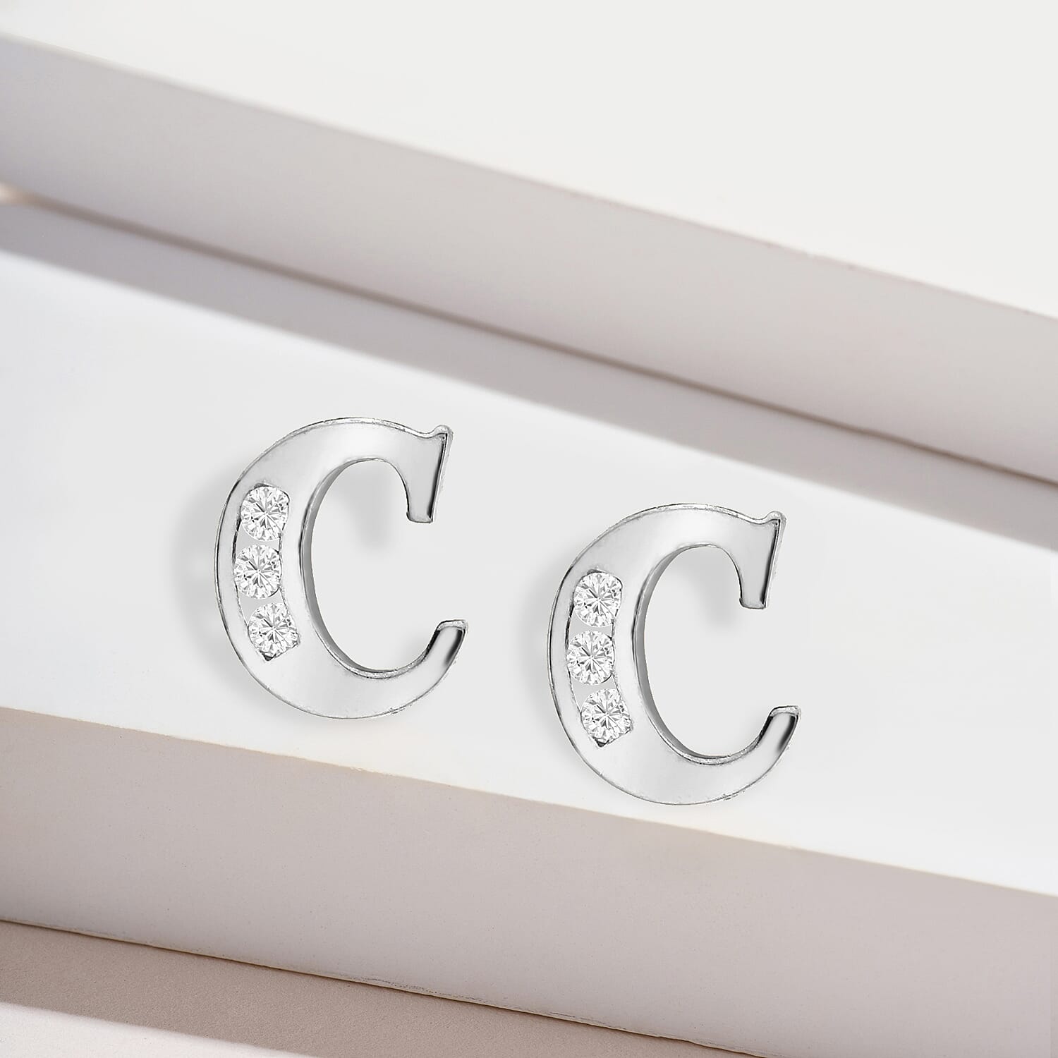 9K White Gold  A   Cubic Zirconia  Earring 0.03 ct,  Gold Wt. 0.57 Gms  0.030  Ct.