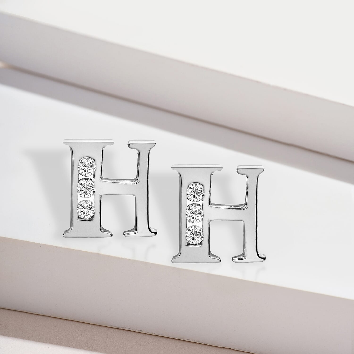 9K White Gold  A   Cubic Zirconia  Earring 0.03 ct,  Gold Wt. 0.59 Gms  0.030  Ct.