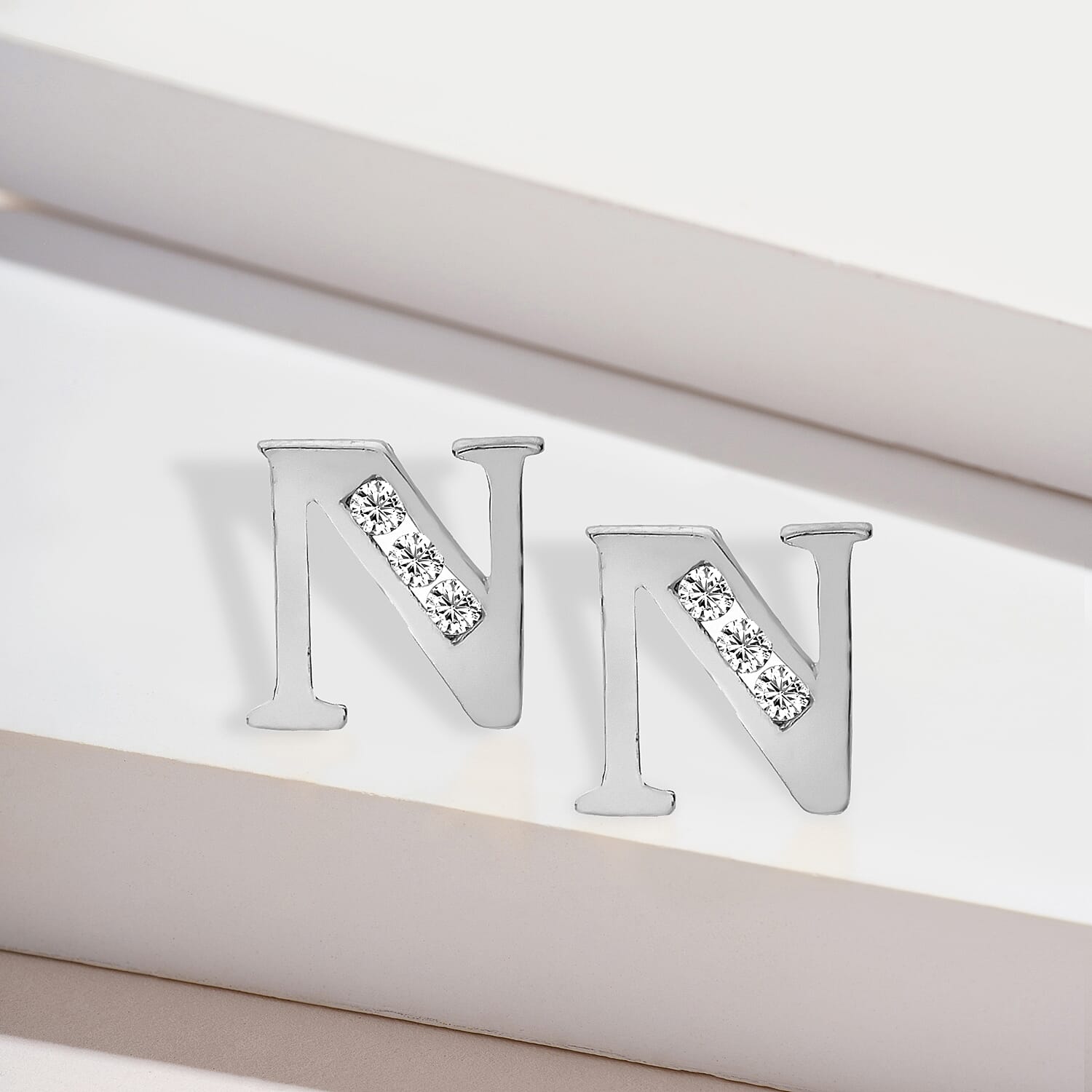 9K White Gold  A   Cubic Zirconia  Earring 0.03 ct,  Gold Wt. 0.62 Gms  0.030  Ct.