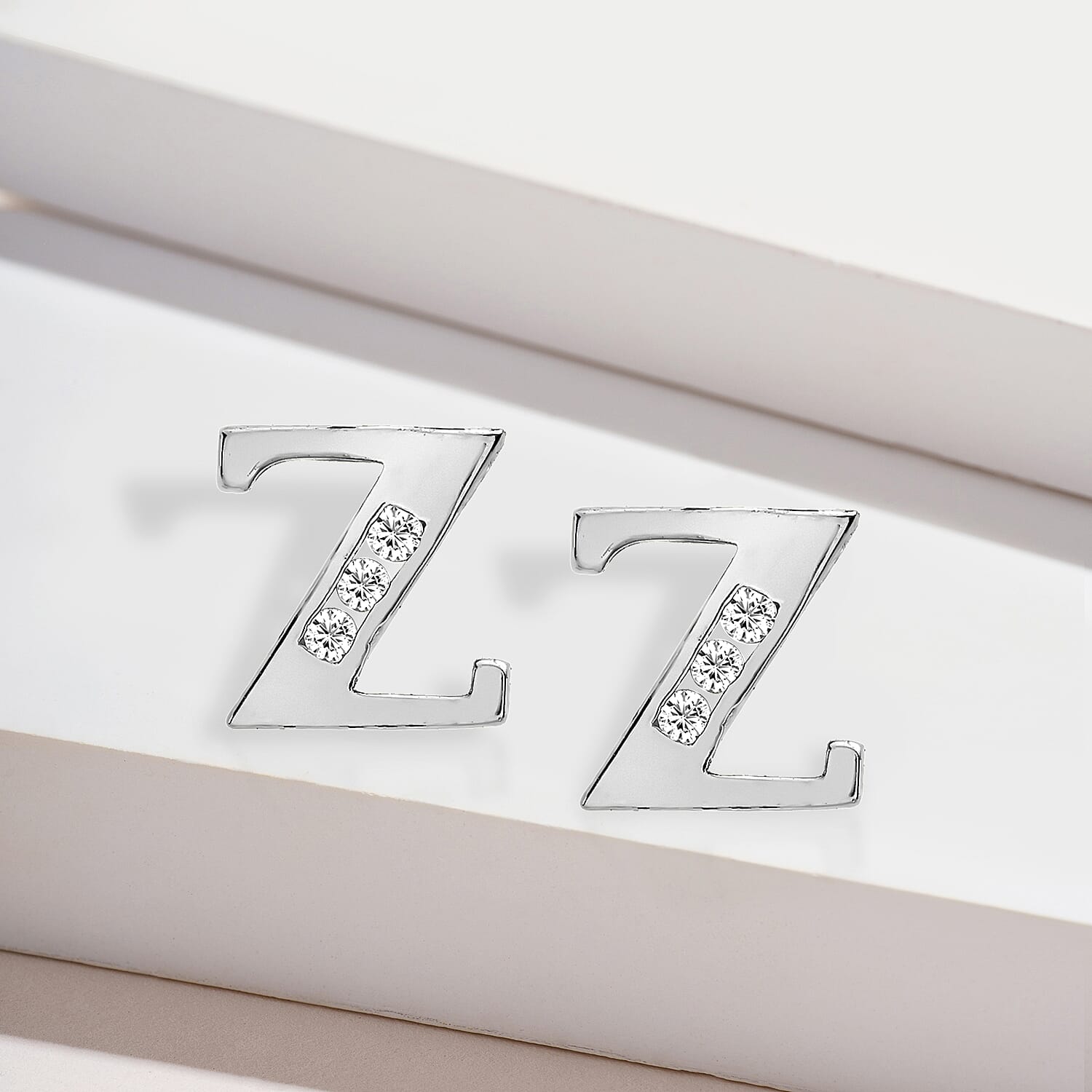 9K White Gold   Cubic Zirconia  Earring 0.03 ct,  Gold Wt. 0.62 Gms  0.030  Ct.