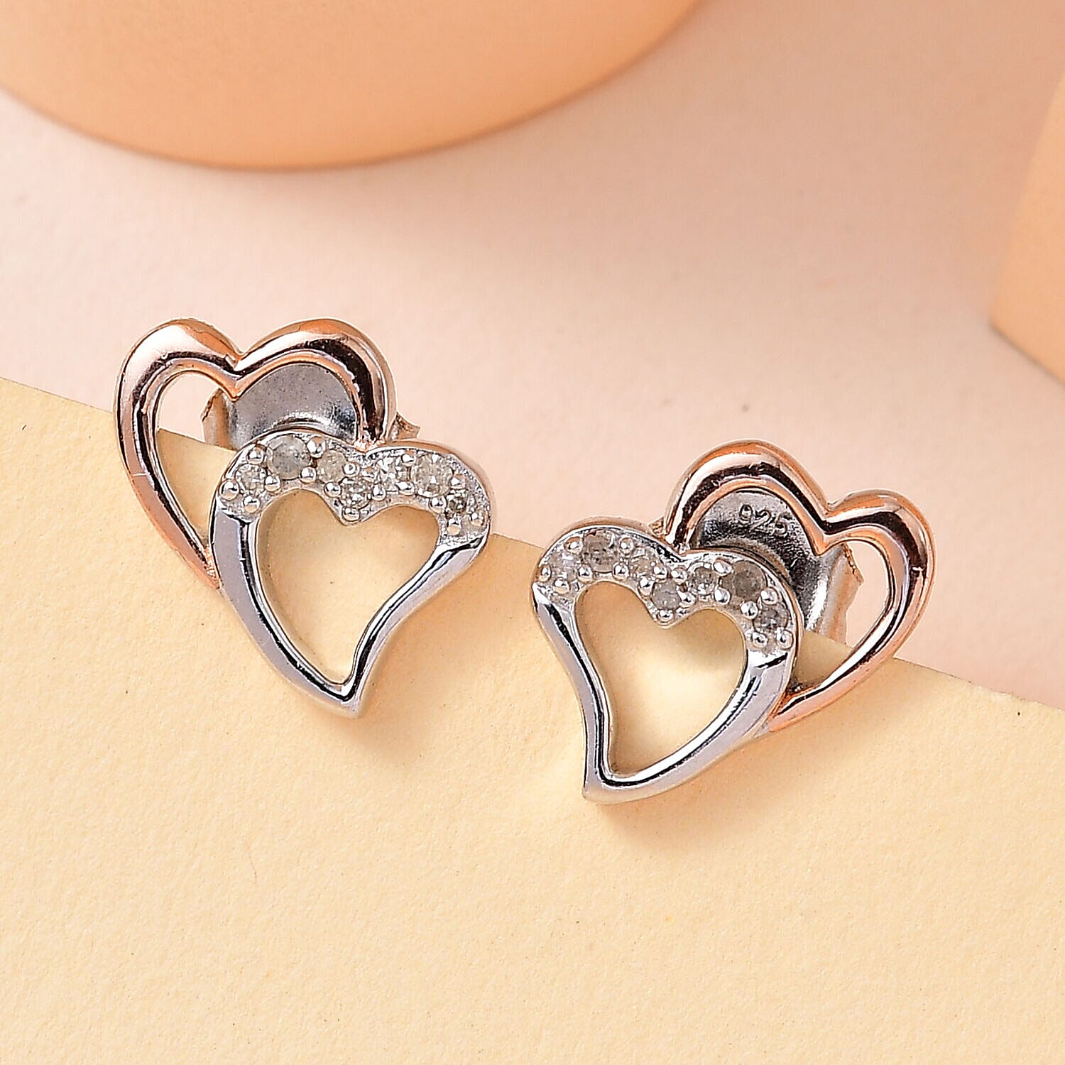 Diamond Stud Heart Earrings in Platinum Overlay and 18K Rose Gold Vermeil Plated Sterling Silver 0.10 Ct.