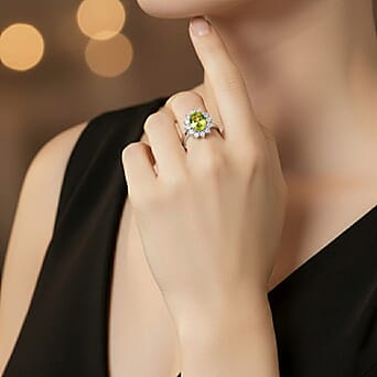 https://tjcuk.sirv.com/Products/75/2/7528203/Hebei-Peridot-August-Birthstone-Halo-Ring-with-Natural-Cambodian-Zirco_7528203_3.jpg?w=342&h=342