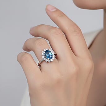 https://tjcuk.sirv.com/Products/75/2/7528213/London-Blue-Topaz-November-Birthstone-Halo-Ring-with-Natural-Cambodian_7528213_1.jpg?w=342&h=342