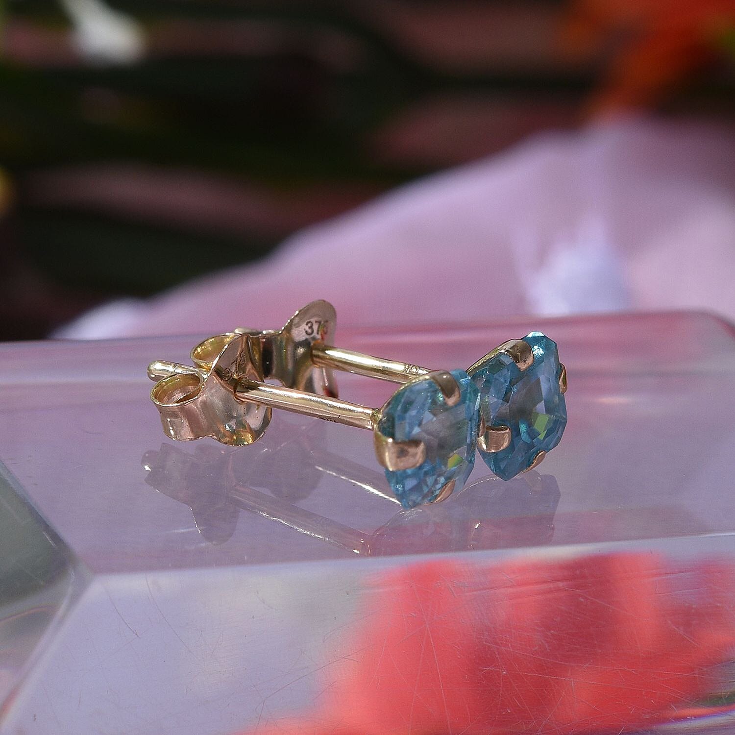 9K White Gold Blue Zircon Solitaire Earrings 1.40 Ct.