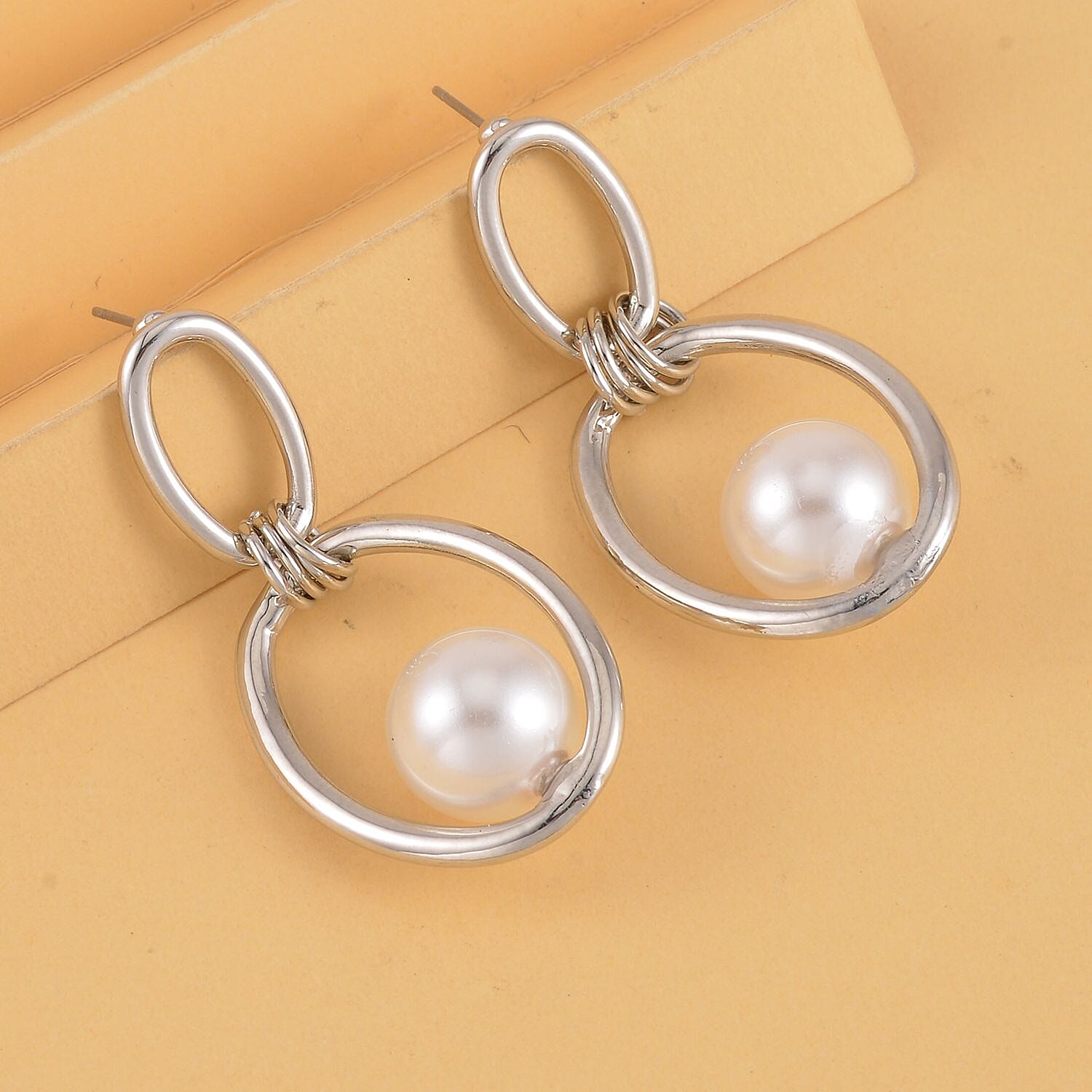 White Shell Pearl Dangle Earrings in Silver Tone