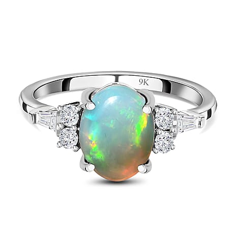 9K White Gold AA Ethiopian Opal, Moissanite Main Stone With Side Stone Ring 1.50 ct, Gold Wt. 2.07 Gms 1.500 Ct. 9K White Gold AA Ethiopian Opal, Moissanite Main Stone With Side Stone Ring 1.50 ct, Gold Wt. 2.07 Gms 1.500 Ct.