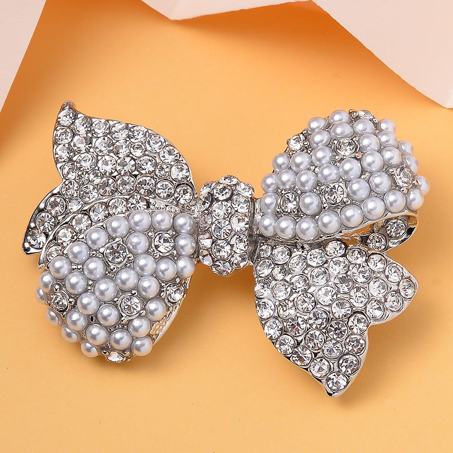 Designer Inspired - White Austrian Crystal Bow Tie Brooch in Silver Tone