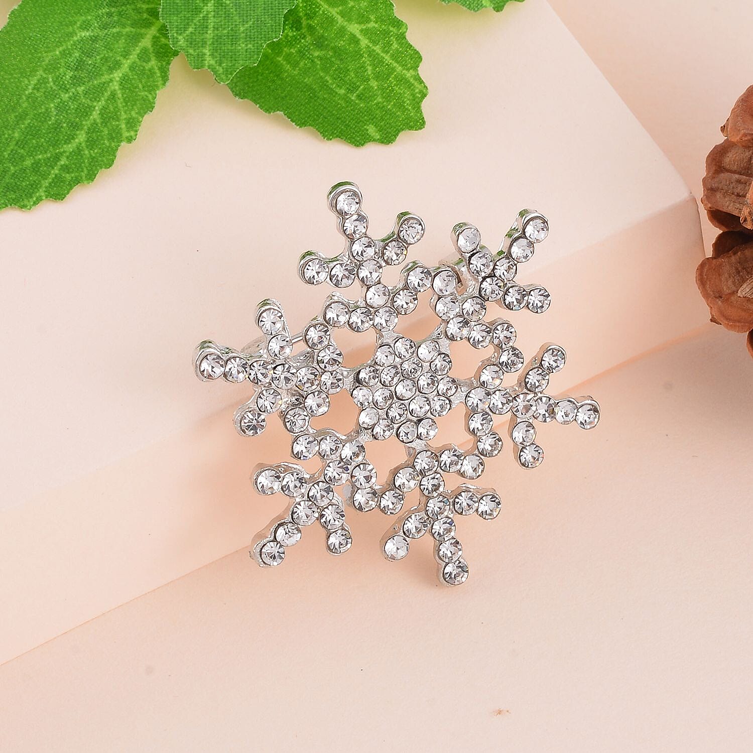 White Austrian Crystal Studded Snowflake Brooch in Antique Silver Tone