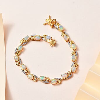 https://tjcuk.sirv.com/Products/77/5/7753542/Ethiopian-Opal-White-Zircon-Cluster-Bracelet-in-Vermeil-YG-Sterling-Si_7753542_1.jpg?w=342&h=342