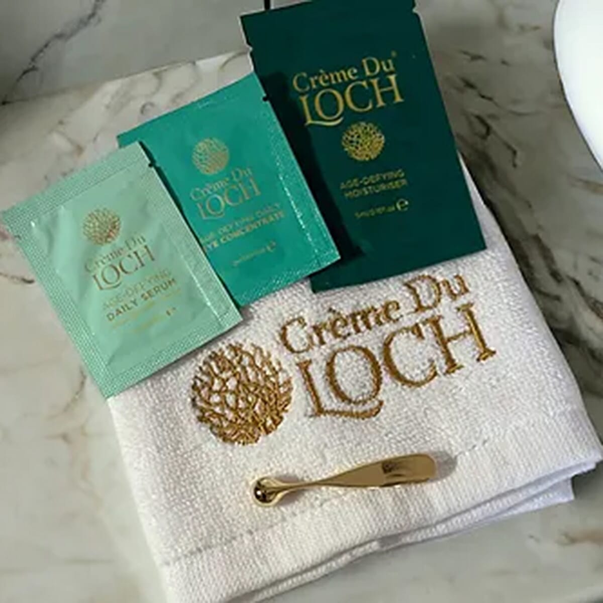 Creme Du Loch Age-Defying Ritual Set (Includes Daily Serum 50ml, Daily Moisturiser 50ml, Eye Conc. 30ml, Spatula, Cleansing Cloth, Ritual Bag & 5ml Moisturiser, 2ml Serum, 2ml Eye Conc.)