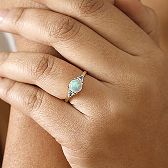 https://tjcuk.sirv.com/Products/78/5/7856075/9K-Yellow-Gold-AA-Ethiopian-Opal-Skyblue-Topaz-Solitaire-Ring-1-10-ct-_7856075_2.jpg?w=342&h=342