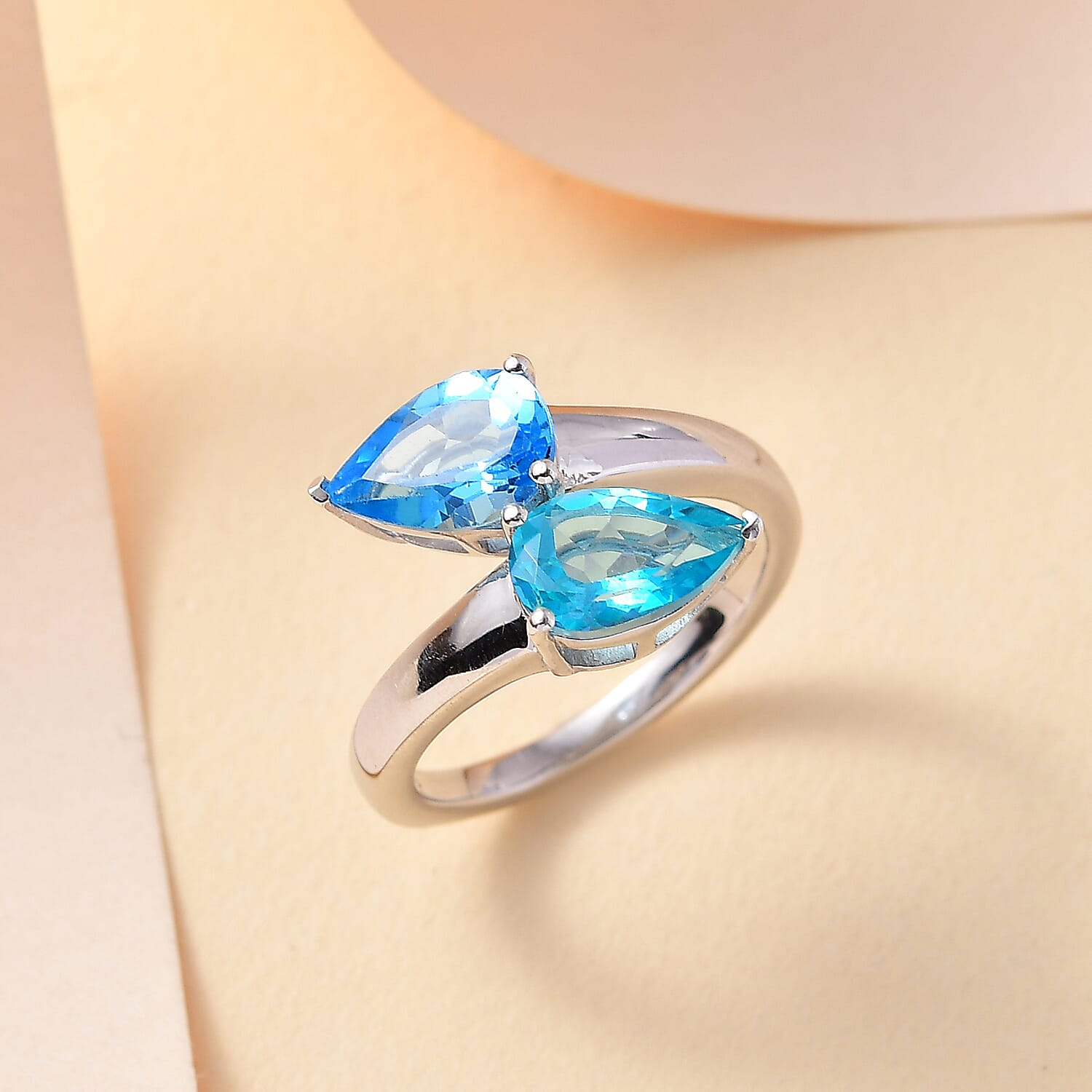 Gem Fiesta - Electric BlueTopaz Bypass Ring in Rhodium Overlay Sterling Silver 2.958 Ct.