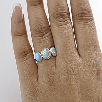 https://tjcuk.sirv.com/Products/80/5/8051491/Tucson-Find-9K-Yellow-Gold-Premium-Ethiopian-Opal-Trilogy-Ring-3-00-ct_8051491_2.jpg?w=342&h=342