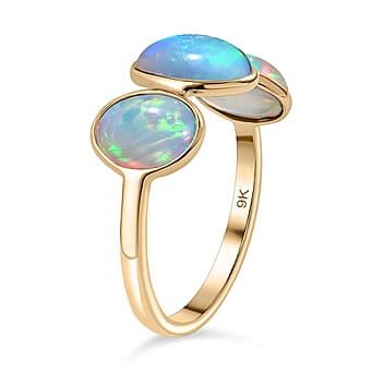 https://tjcuk.sirv.com/Products/80/5/8051491/Tucson-Find-9K-Yellow-Gold-Premium-Ethiopian-Opal-Trilogy-Ring-3-00-ct_8051491_3.jpg?w=342&h=342