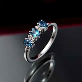 https://tjcuk.sirv.com/Products/81/3/8134373/London-Blue-Topaz-White-Zircon-3-Stone-Ring-in-Platinum-OverlaySterlin_8134373_2.jpg?w=342&h=342