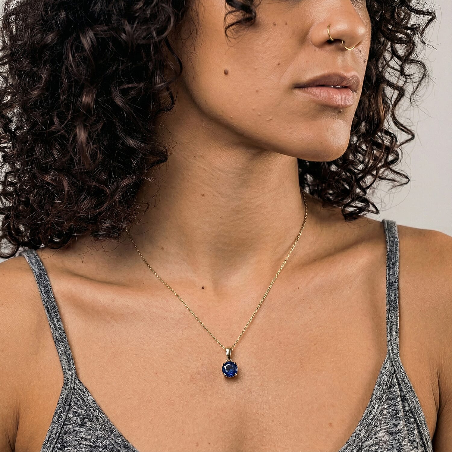 9K Yellow Gold AA Fissure Filled Blue Sapphire Pendant 1.22 Ct.