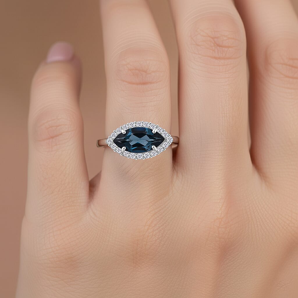 D'Joy London Blue Topaz & Moissanite Ring in Rhodium Overlay Sterling Silver 2.14 Ct.