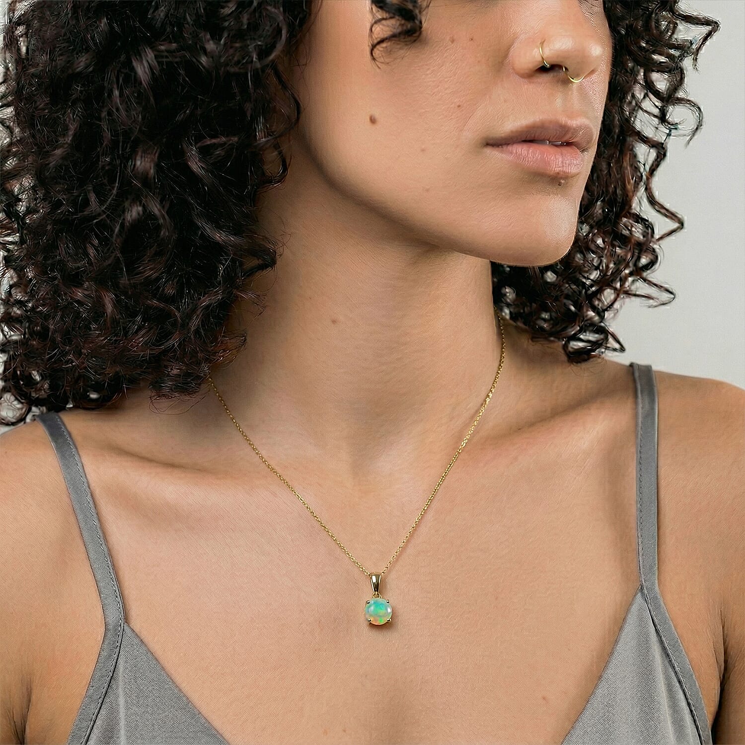 9K Yellow Gold AA Ethiopian Opal Pendant 0.53 Ct.