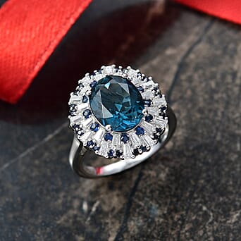 https://tjcuk.sirv.com/Products/82/9/8299514/D-Joy-London-Blue-Topaz-Blue-Sapphire-Moissanite-Ring-in-Rhodium-Overl_8299514_1.jpg?w=342&h=342