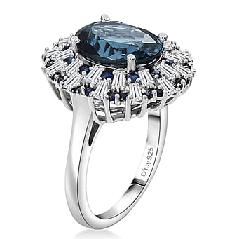 https://tjcuk.sirv.com/Products/82/9/8299514/D-Joy-London-Blue-Topaz-Blue-Sapphire-Moissanite-Ring-in-Rhodium-Overl_8299514_3.jpg?w=342&h=342